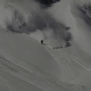Snowboarding And Skis Running From An Avalanche