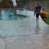 Dad Gives Son Giant Lollipop To Push Mom In The Pool Shorts