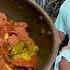 COOKING BEEF STIR AND BOILED CASSAVA LEAVES WITH GREEN CHILI